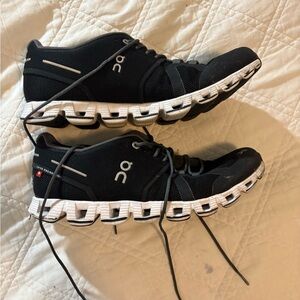 On Running Black and White Athletic Shoes with Unique Sole Design